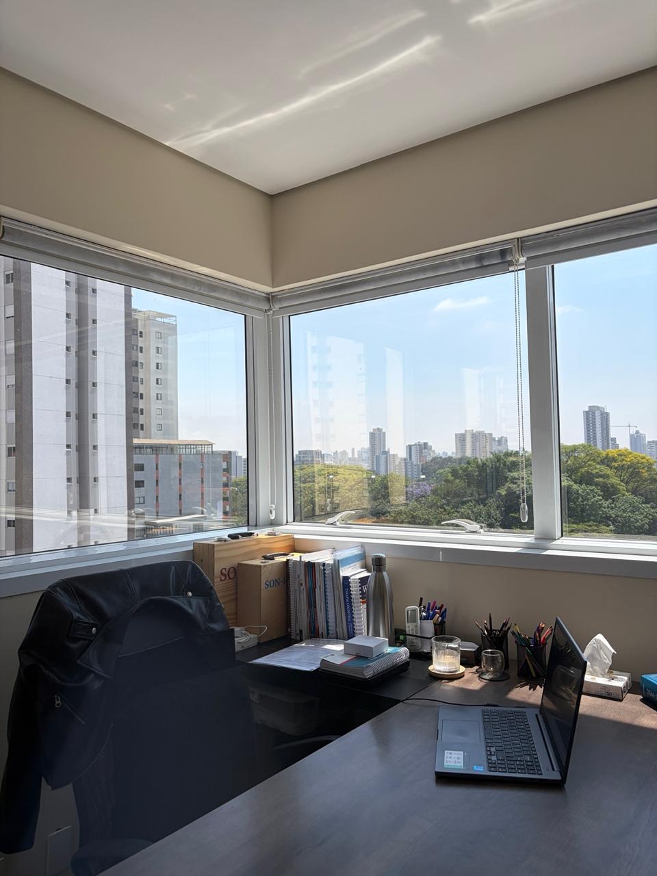 Consulting room with wide windows over the city skyline